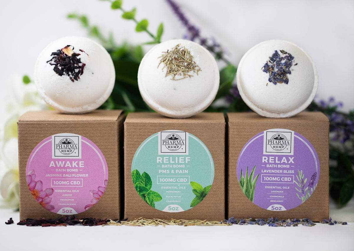 three assorted-label bath bombs with boxes