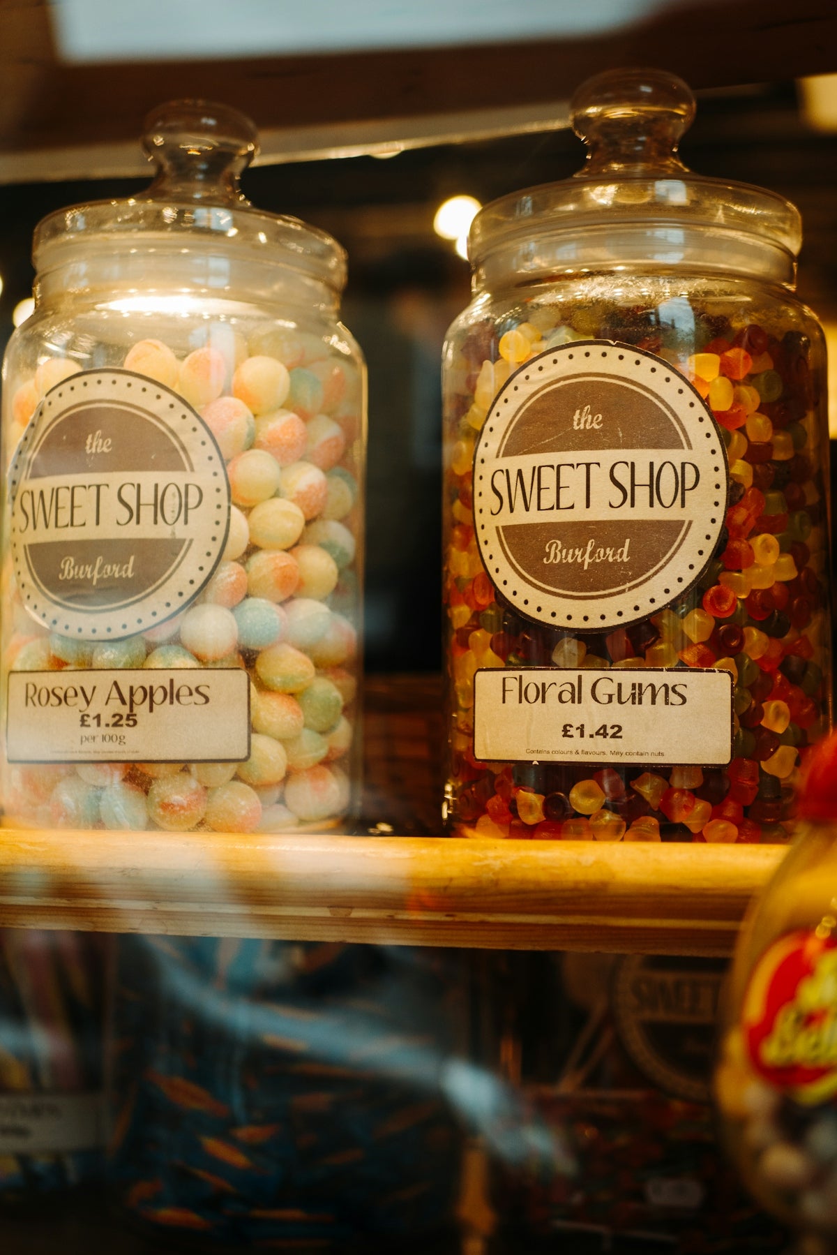 two clear glass canisters with candies