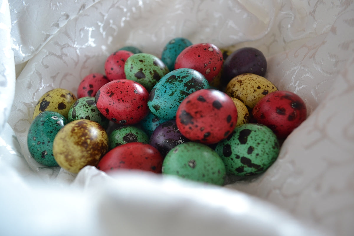 green red and yellow beads on white plastic container