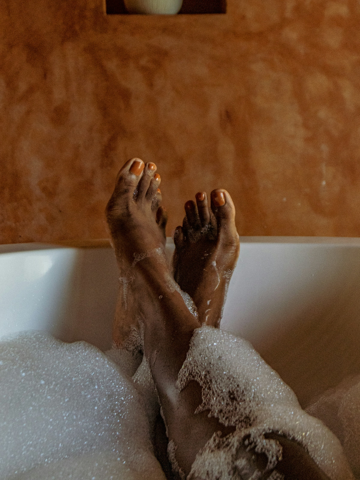 person in bathtub with water