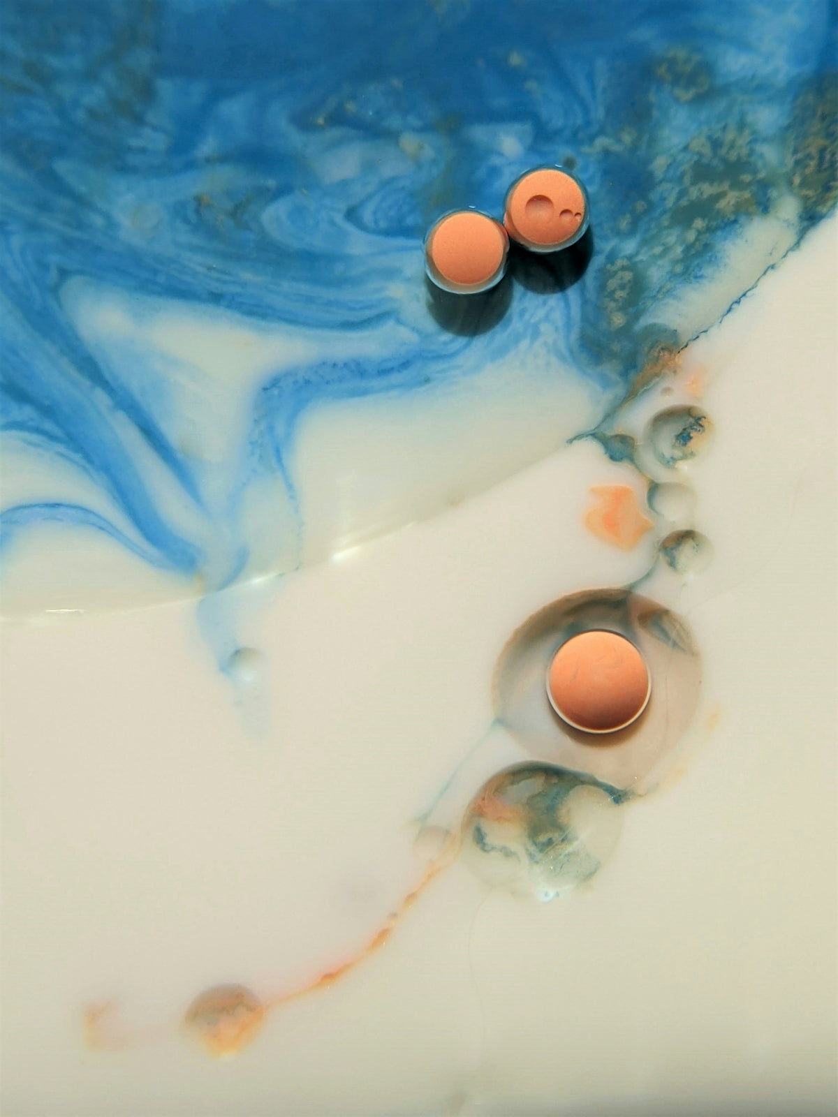 two eggs are sitting in a blue and white bowl