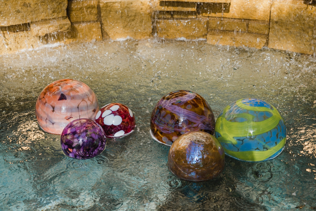 a group of colorful balls in a pool