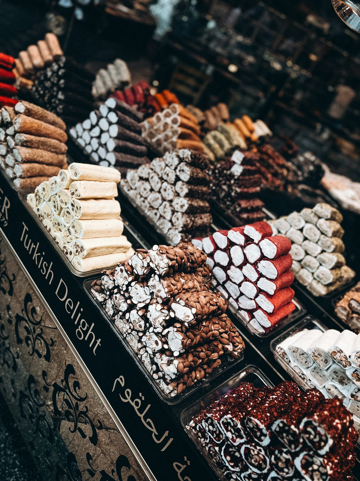 a display case filled with lots of different types of desserts