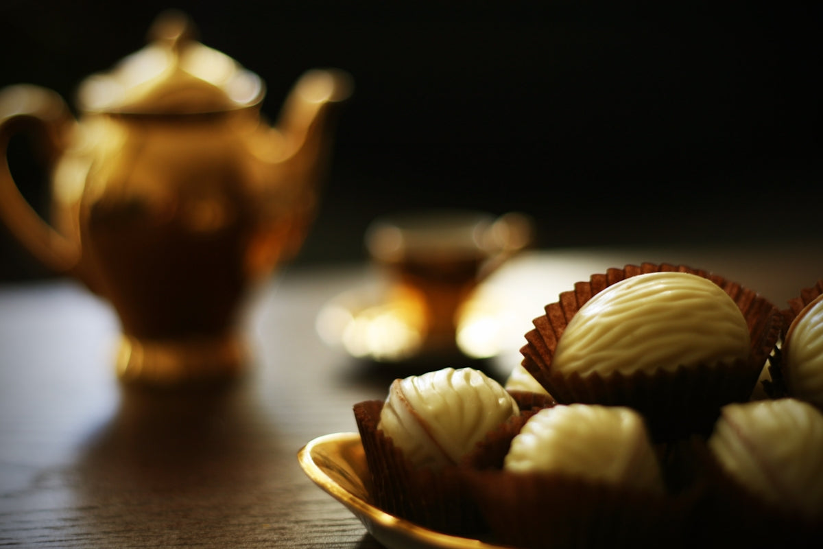 a close up of a plate of chocolates on a table