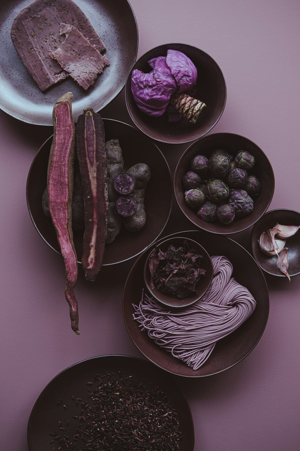 A table topped with bowls filled with different types of food